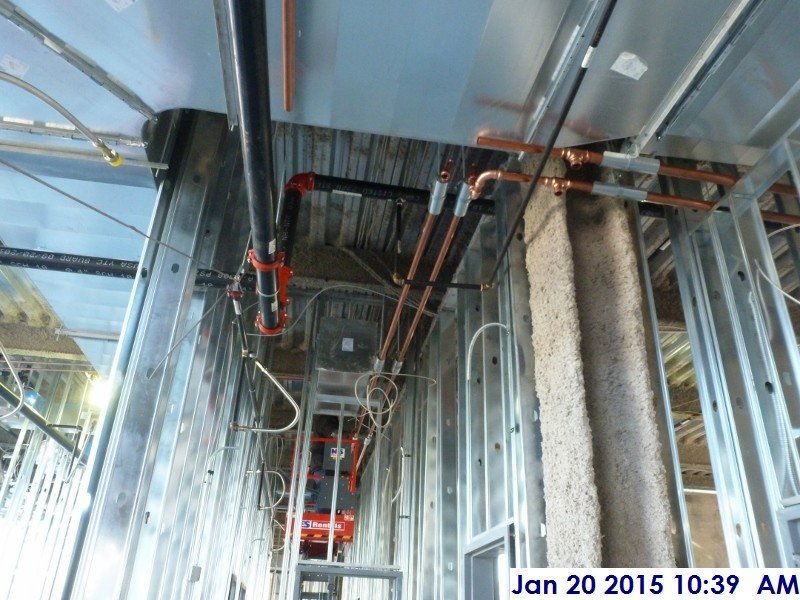 Installing copper piping at the 3rd floor Facing East